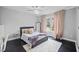 Cozy bedroom with soft natural lighting and light pink curtains at 1637 Dodford Ct, Wake Forest, NC 27587