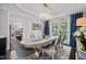 Dining room featuring stylish chairs, elegant decor, a modern chandelier, and lots of natural light at 1637 Dodford Ct, Wake Forest, NC 27587