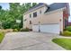 The back of the house features a three car garage and basketball hoop at 1637 Dodford Ct, Wake Forest, NC 27587