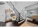 Elegant foyer boasts hardwood floors, a staircase with metal railings, and ornate decor at 1637 Dodford Ct, Wake Forest, NC 27587