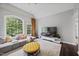 Bright living room with large windows, comfortable seating, and modern decor at 1637 Dodford Ct, Wake Forest, NC 27587