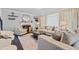 Comfortable living room with a fireplace, decorative mirror, and stylish seating arrangement at 1637 Dodford Ct, Wake Forest, NC 27587
