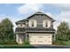 Charming two-story home with gray siding, white trim, and a two-car garage at 179 New Twin Branch Ct, Smithfield, NC 27577