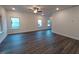 Bright living room featuring sleek flooring, recessed lighting and multiple windows, offering lots of natural light at 179 New Twin Branch Ct, Smithfield, NC 27577