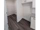 A kitchen walk-in pantry features wire shelving, providing ample storage for food and supplies at 179 New Twin Branch Ct, Smithfield, NC 27577
