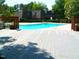Community pool with a spacious deck and surrounding greenery at 192 Summerwalk Cir, Chapel Hill, NC 27517
