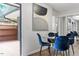 Cozy dining area with modern art, stylish blue chairs, and access to a private outdoor patio at 192 Summerwalk Cir, Chapel Hill, NC 27517