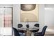 Cozy dining area with glass top table, stylish velvet chairs, modern art, and natural light at 192 Summerwalk Cir, Chapel Hill, NC 27517