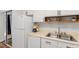 Bright kitchen with white appliances and cabinets, complete with dishwasher and refrigerator at 192 Summerwalk Cir, Chapel Hill, NC 27517