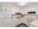 Bright kitchen with white appliances, and plenty of cabinet space for all your cooking needs at 192 Summerwalk Cir, Chapel Hill, NC 27517