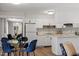 Bright kitchen with white cabinetry, stainless steel appliances, and an adjacent dining area at 192 Summerwalk Cir, Chapel Hill, NC 27517