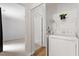 Convenient laundry area with washer, dryer, and shelving for organized storage solutions at 192 Summerwalk Cir, Chapel Hill, NC 27517