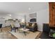 Cozy living room with wood-look flooring, stylish furniture, and fireplace at 192 Summerwalk Cir, Chapel Hill, NC 27517