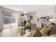 Bright and airy living room featuring a dining area, modern art, and a slider to outside at 192 Summerwalk Cir, Chapel Hill, NC 27517