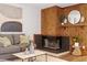 Cozy living room with wood paneled fireplace and stylish decor provides a relaxing atmosphere at 192 Summerwalk Cir, Chapel Hill, NC 27517
