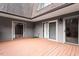 Back patio with privacy fence and sliding glass doors at 192 Summerwalk Cir, Chapel Hill, NC 27517