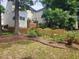 Exterior view of backyard featuring a new fence and shrubbery at 1937 Crag Burn Ln, Raleigh, NC 27604
