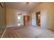 Cozy bedroom features neutral carpeting, and entrances to bathroom and second floor at 1937 Crag Burn Ln, Raleigh, NC 27604