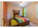 Comfortable bedroom featuring a single bed, carpet, and a window at 1937 Crag Burn Ln, Raleigh, NC 27604