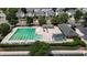 Community pool area with a large swimming pool, lounge chairs, and building with covered area at 1937 Crag Burn Ln, Raleigh, NC 27604