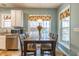 Eat-in kitchen area with dining table, lots of natural light, and stainless steel appliances at 1937 Crag Burn Ln, Raleigh, NC 27604