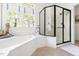 Modern bathroom with soaking tub and glass-enclosed shower at 20007 Bragg, Chapel Hill, NC 27517