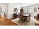 Formal dining room boasting hardwood floors, chandelier, piano, and seating for eight at 20007 Bragg, Chapel Hill, NC 27517
