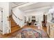 Spacious foyer featuring wood floors, staircase, and opens to the living room at 20007 Bragg, Chapel Hill, NC 27517