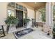 A cozy front porch with flagstone, potted plants, and a rocking chair evokes a welcoming feeling at 20007 Bragg, Chapel Hill, NC 27517
