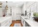 Bright kitchen featuring white countertops, stainless steel appliances, and hardwood floors at 20007 Bragg, Chapel Hill, NC 27517