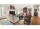 Well-lit living room with elegant furniture, decorative fireplace, and access to outdoor spaces at 20007 Bragg, Chapel Hill, NC 27517
