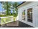 Back deck providing outdoor access with a view of the home's landscaped yard at 208 Dry Canyon Dr, Wendell, NC 27591