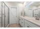 Bathroom with double vanity, tile flooring, and glass shower at 208 Dry Canyon Dr, Wendell, NC 27591
