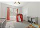 Well-lit room featuring a playhouse, changing table and a view outside at 208 Dry Canyon Dr, Wendell, NC 27591