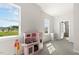 Bedroom room features large windows and a play kitchen set at 208 Dry Canyon Dr, Wendell, NC 27591