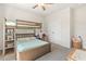 Cozy bedroom with a wooden bunk bed, a ceiling fan, and carpeted flooring at 208 Dry Canyon Dr, Wendell, NC 27591