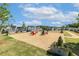 Community gathering spot with chairs on crushed gravel, framed by landscaping, and surrounded by homes at 208 Dry Canyon Dr, Wendell, NC 27591
