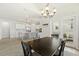 Dining room with a view of the kitchen, stainless steel appliances, and an island at 208 Dry Canyon Dr, Wendell, NC 27591