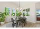 Bright dining area featuring windows, neutral walls, and modern accents at 208 Dry Canyon Dr, Wendell, NC 27591
