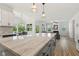 Bright kitchen with an island, granite countertops, and an open floor plan at 208 Dry Canyon Dr, Wendell, NC 27591