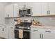 Kitchen featuring white cabinetry, stainless steel appliances, and granite countertops at 208 Dry Canyon Dr, Wendell, NC 27591