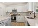 Kitchen featuring white cabinetry, stainless steel appliances, and granite countertops at 208 Dry Canyon Dr, Wendell, NC 27591