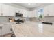Kitchen featuring an island, stainless steel appliances, and white cabinetry at 208 Dry Canyon Dr, Wendell, NC 27591