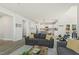Open floor plan from the living room showcasing the kitchen with white cabinetry and an island at 208 Dry Canyon Dr, Wendell, NC 27591