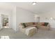 Bright living room features plush carpet and cozy sectional sofa at 208 Dry Canyon Dr, Wendell, NC 27591