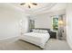 Comfortable main bedroom with decorative ceiling, carpet, and bright windows at 208 Dry Canyon Dr, Wendell, NC 27591