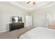 Bedroom features a TV and a sleek black dresser for storage at 208 Dry Canyon Dr, Wendell, NC 27591