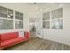 Well lit screened-in porch with outdoor seating, string lights, and exterior views at 208 Dry Canyon Dr, Wendell, NC 27591