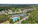 Community aerial view featuring pool, tennis court, clubhouse, ample parking, and neighborhood streets at 2135 Vittorio Ln, Apex, NC 27502