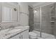 Bathroom with modern sink and shower, featuring tiled walls and glass door at 2135 Vittorio Ln, Apex, NC 27502